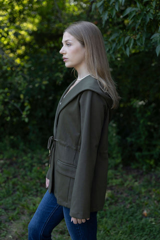 She means business drawstring jacket dark green front pockets long sleeve side view by hem & thread